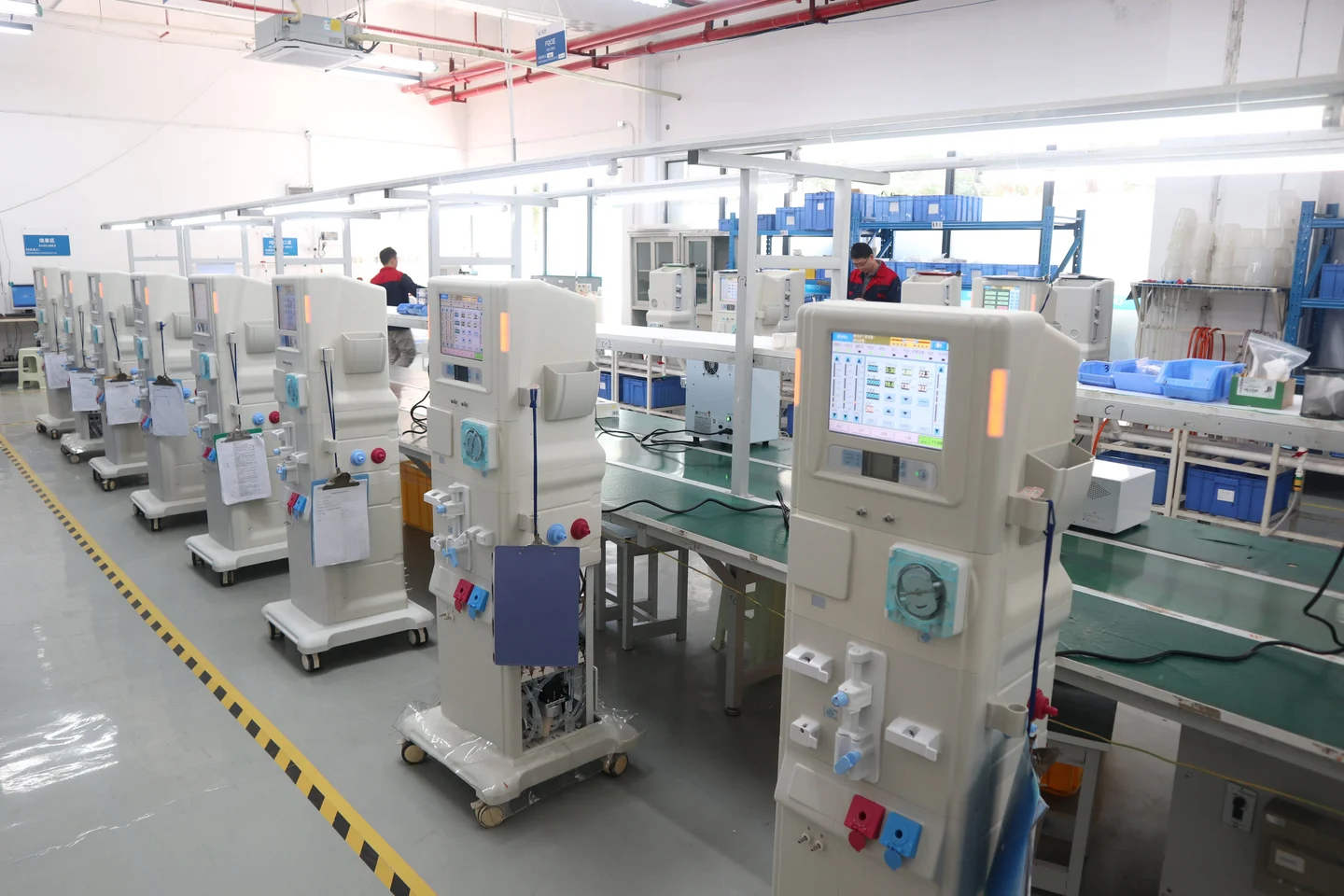 Dialysis equipment on production workbenches.