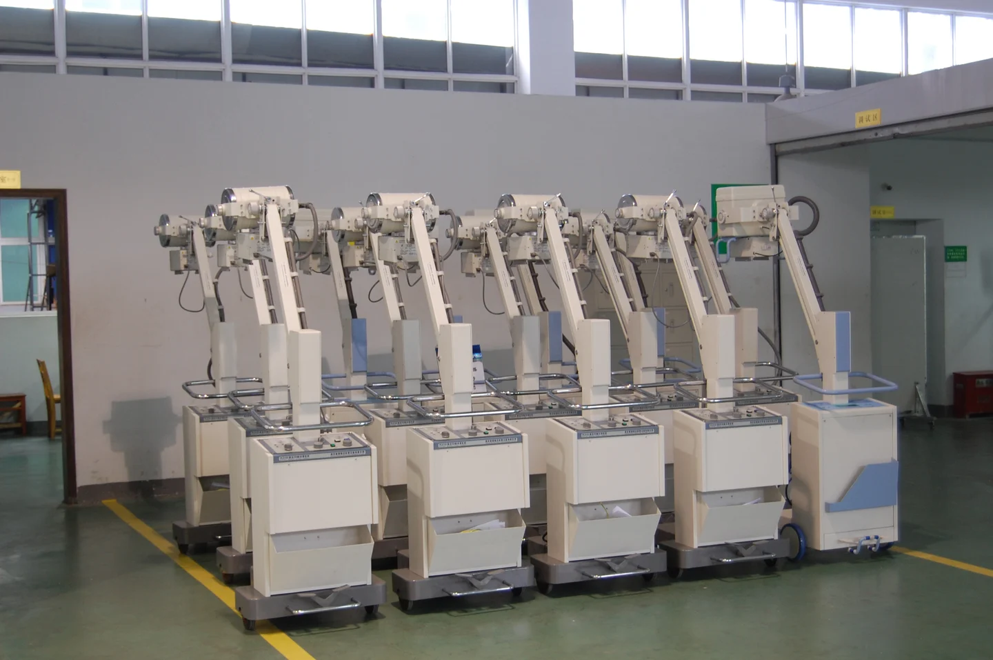Mobile X-ray equipment in an assembly workshop.