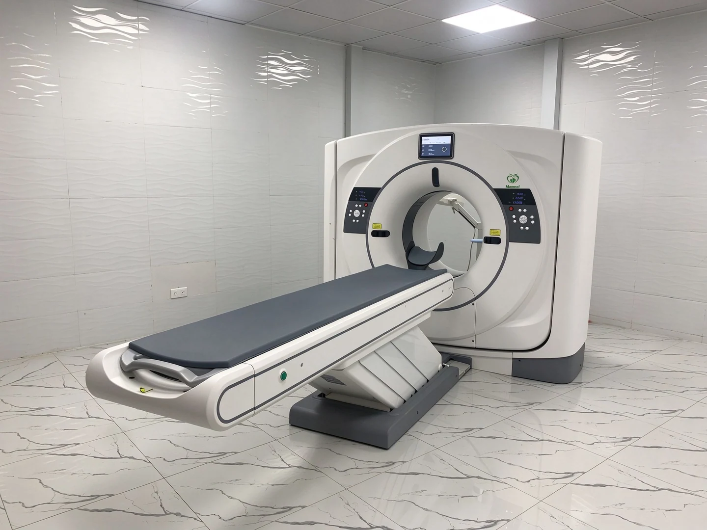 Assembled CT scanner and examination table in the Senegal project room.