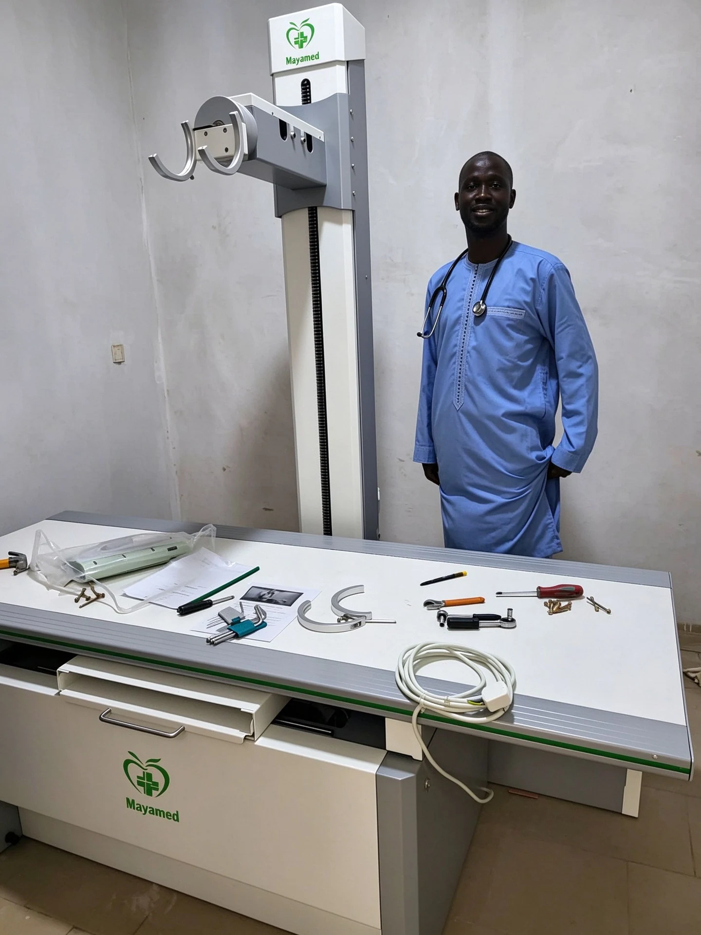 A person beside the MY-D023G X-ray equipment at the Senegal project site.