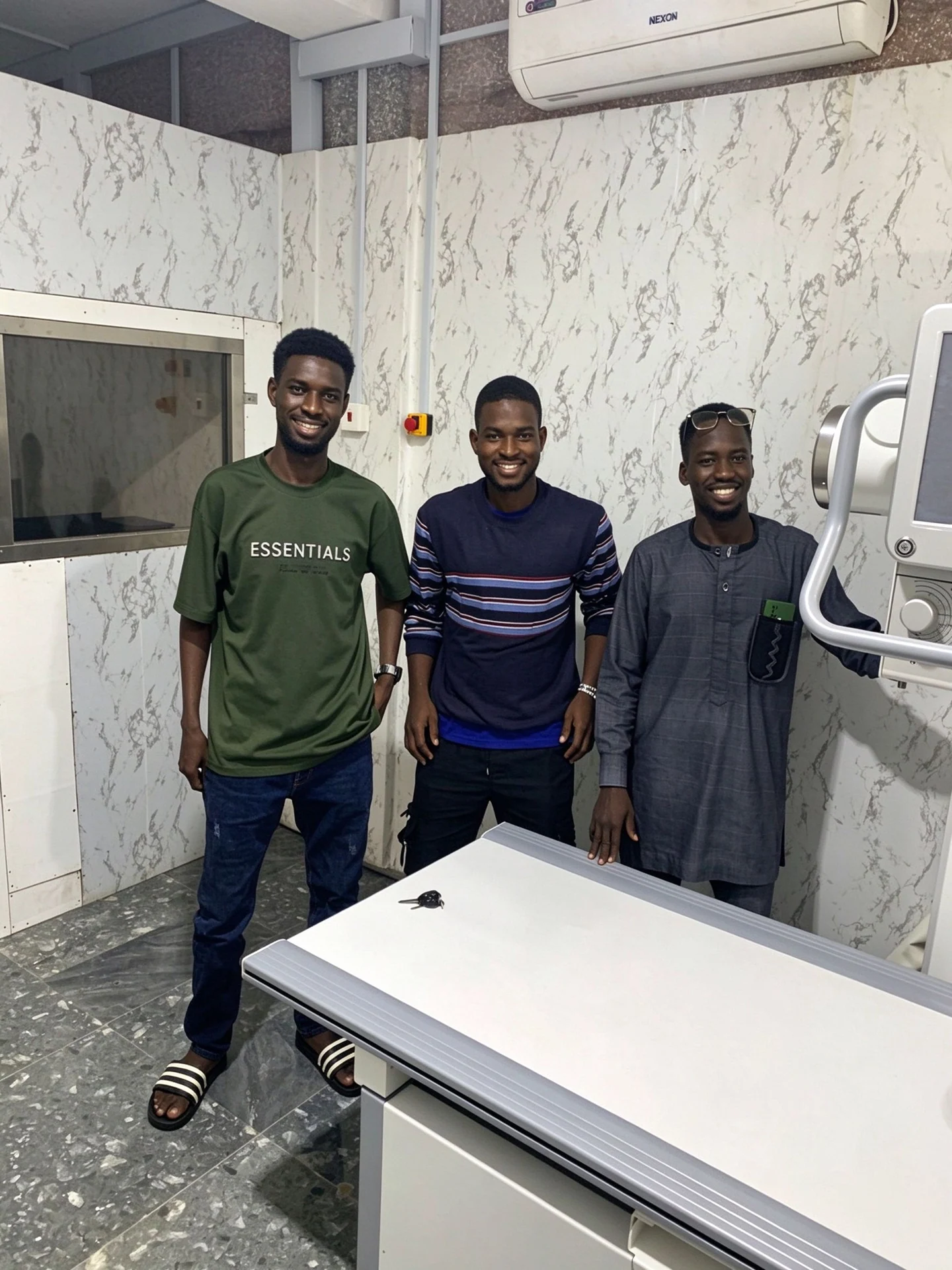 Engineers and customer team beside the X-ray equipment at the Togo project site.